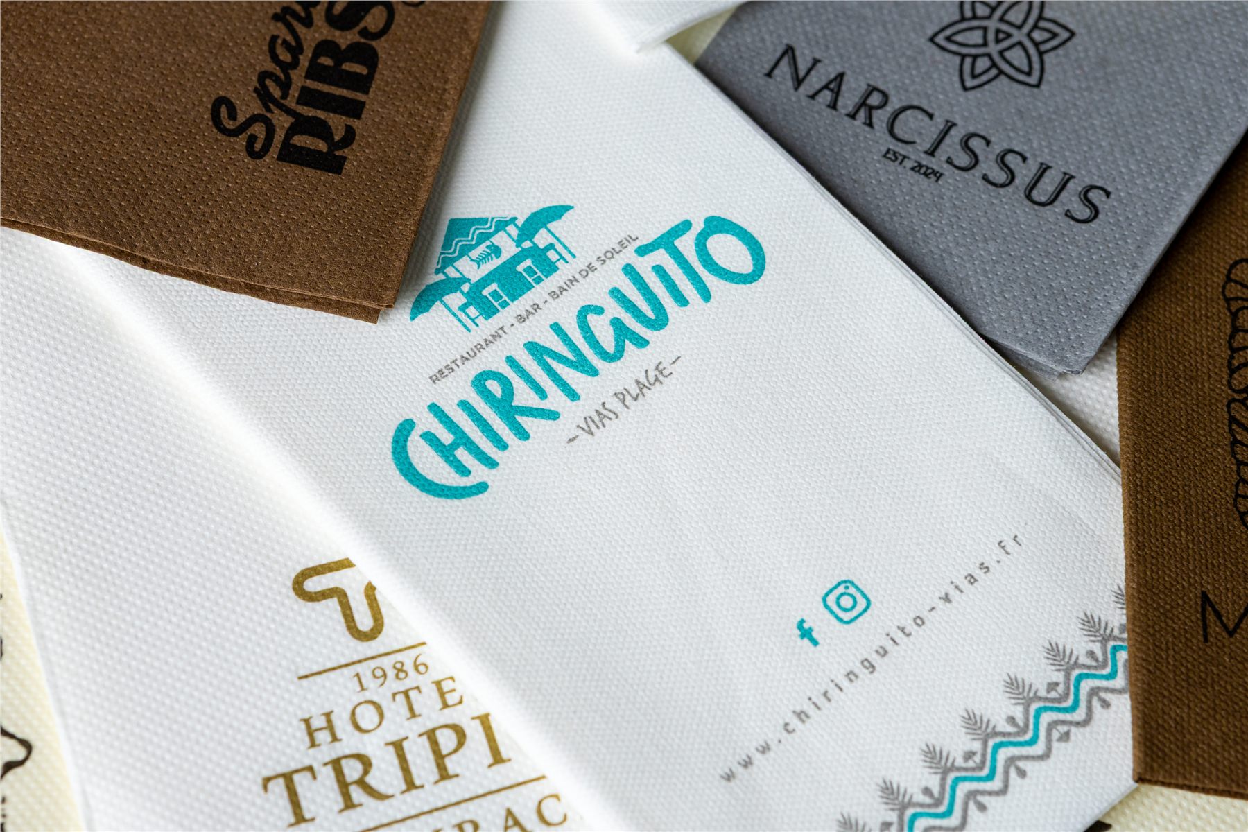Close-up of a logo-printed napkin in white